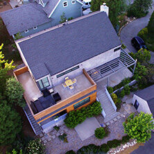 Aerial view of house with shingled roof